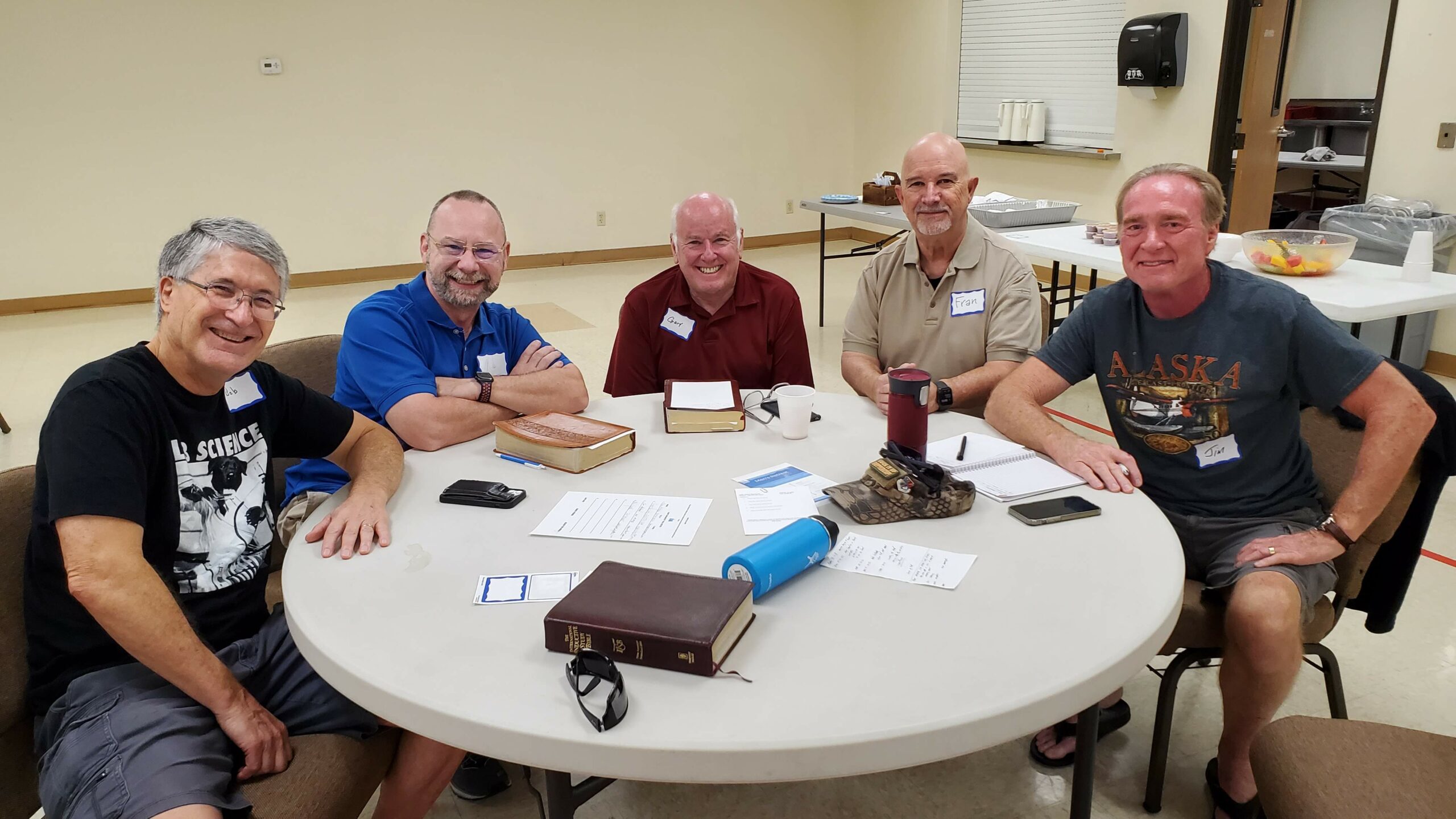 men's bible study sitting at a table